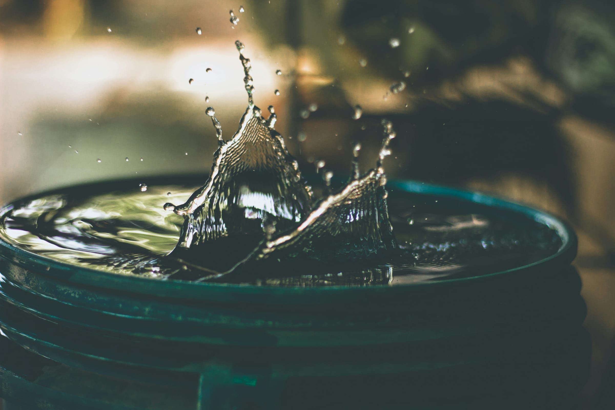 Water dripping from a leak into a bucket